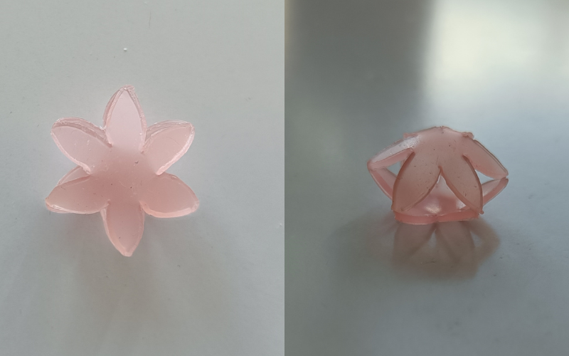 2 photos side by side of the same piece from different angles. 2 flower shapes layered together with the tips of the petals touching creating a hollow form. Left photo from top, right from the side so you can see the hollow shape