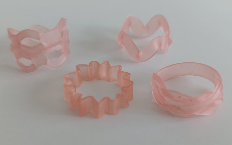 4 rings from strips of pink sheet wax. All wavy based 