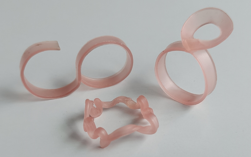 3 rings from strips of pink sheet wax. One for a double finger, one with a circle over the finger, one doodled