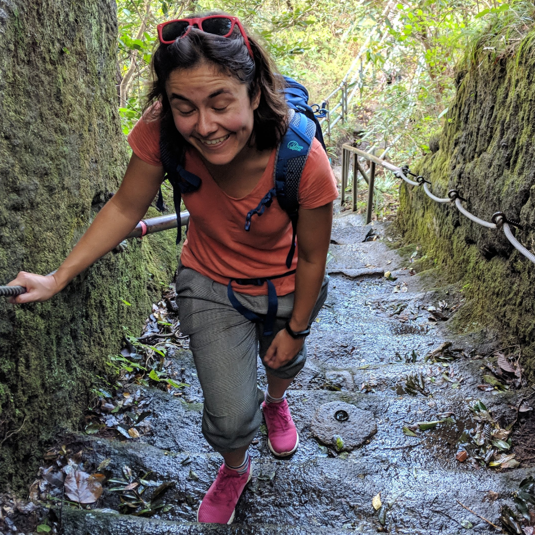 Me walking up a set of stairs on a mountain, clearly tired