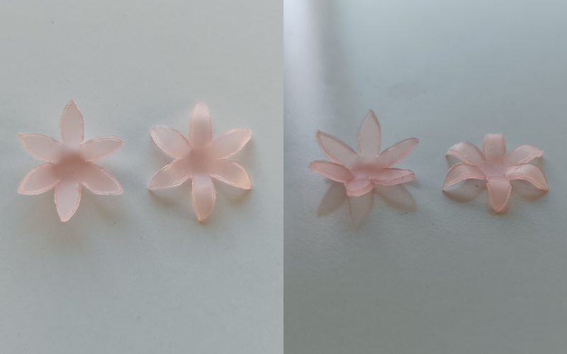 2 side by side photos of the same pieces from different angles. Left 2 flowers from pink sheet wax with gently folded up petals and the tips fold back. Left photographed from above, right photographed from the side so you can see the bend clearer  